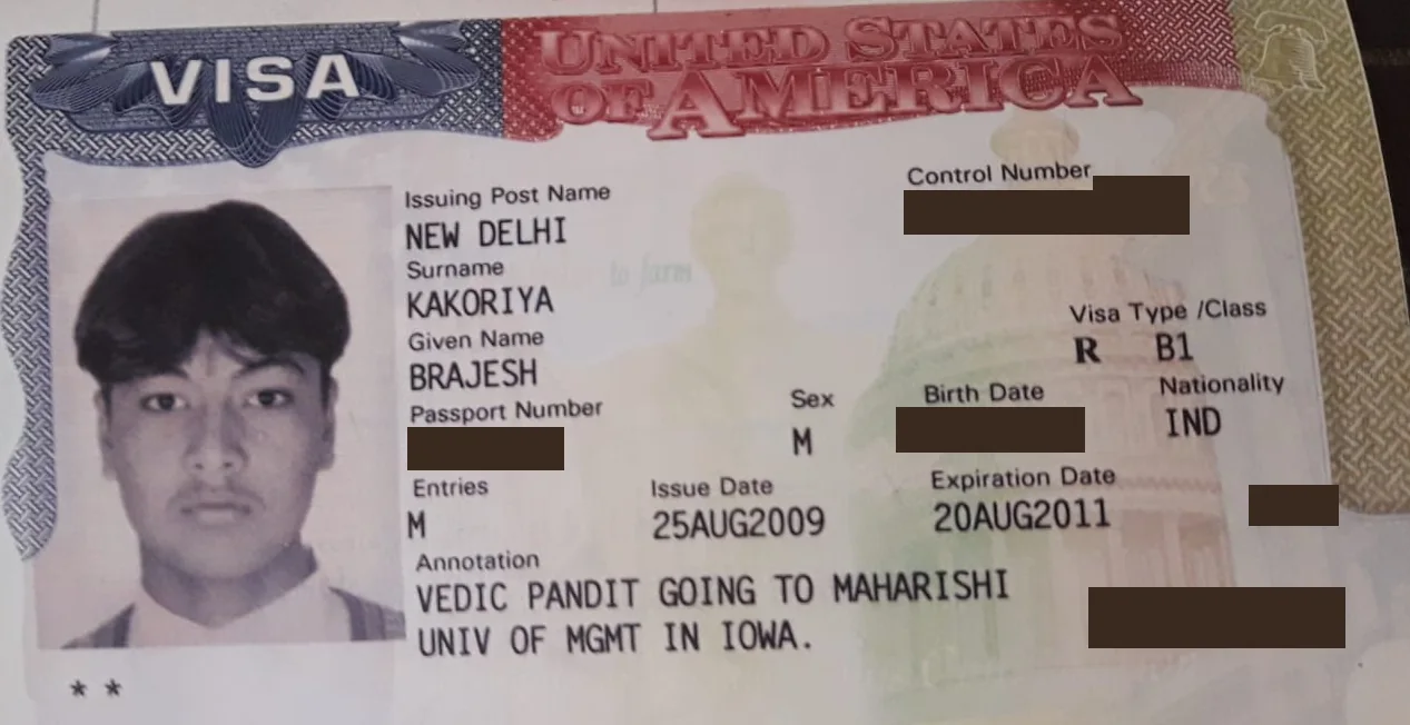 US visa of Pt. Brajesh Maharaj, type B-1, with the printed annotation “VEDIC PANDIT GOING TO MAHARISHI UNIV OF MGMT IN IOWA”. Personal numbers are blacked out.